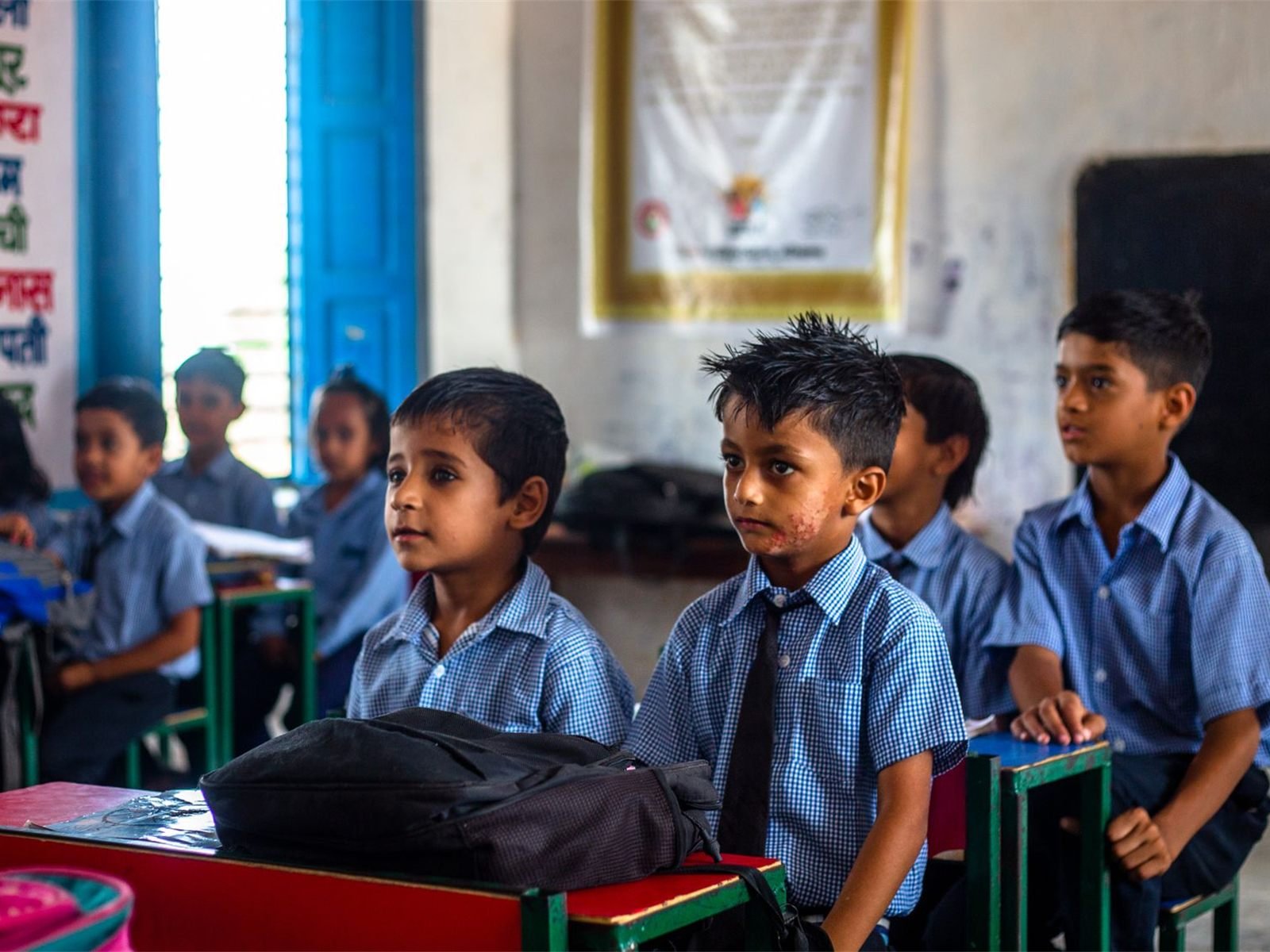 Indian school children listening during a classroom lesson