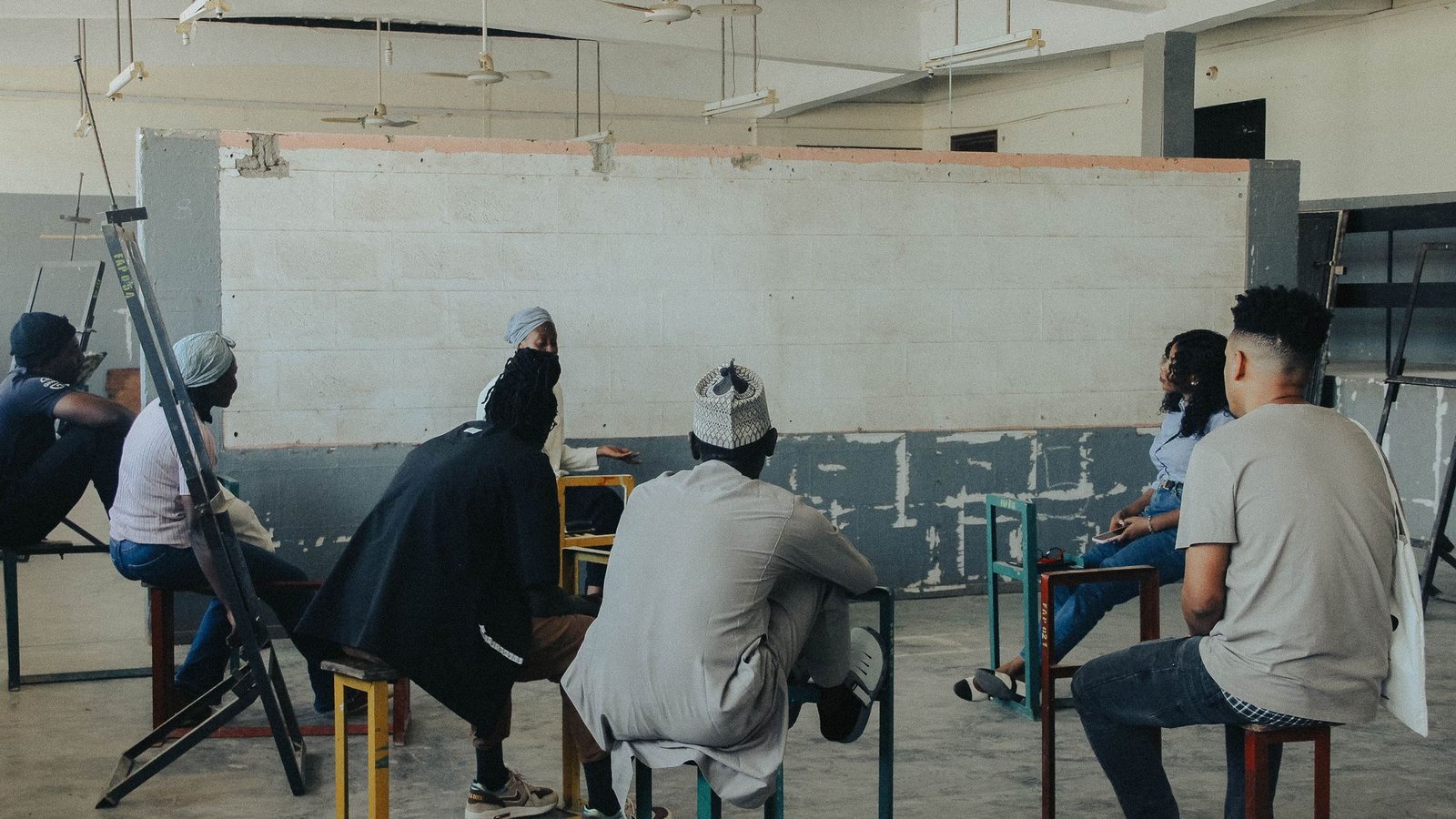 Adults gathered for a discussion in an education workshop setting