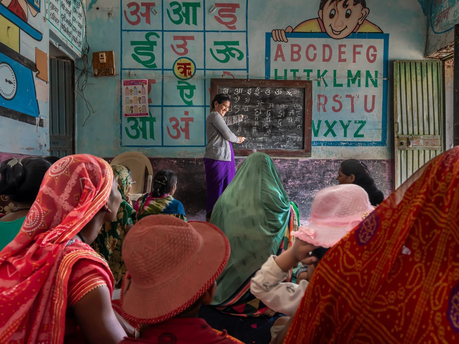 Women attending an educational session in a rural Indian classroom