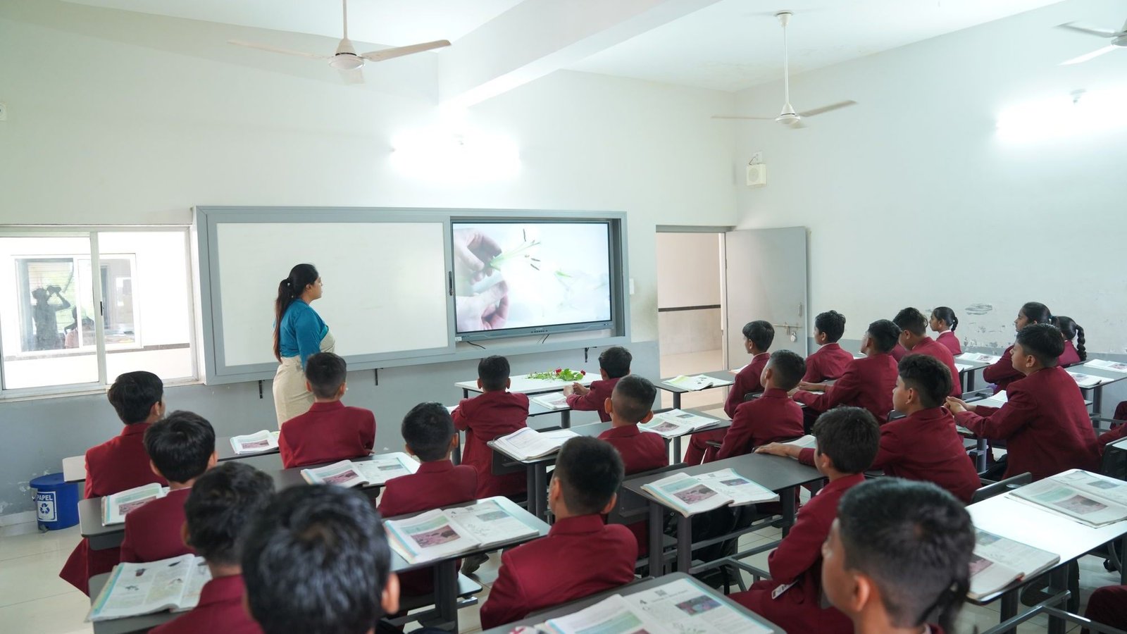 Students learning with an interactive classroom display in Gujarat, India